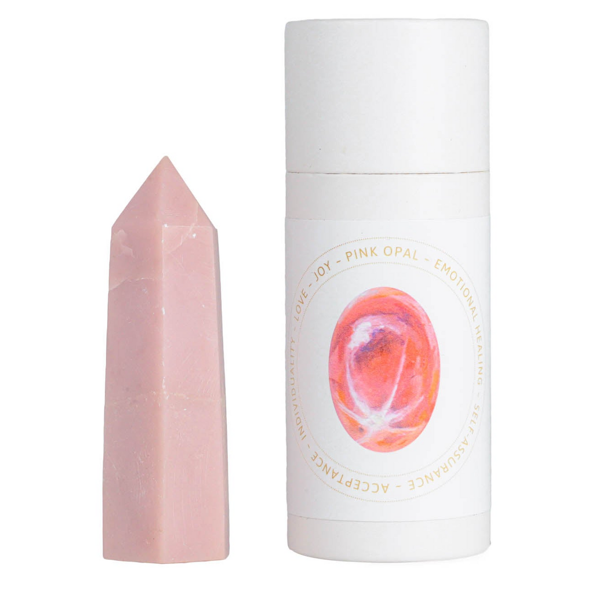 a pink stone next to a white tube