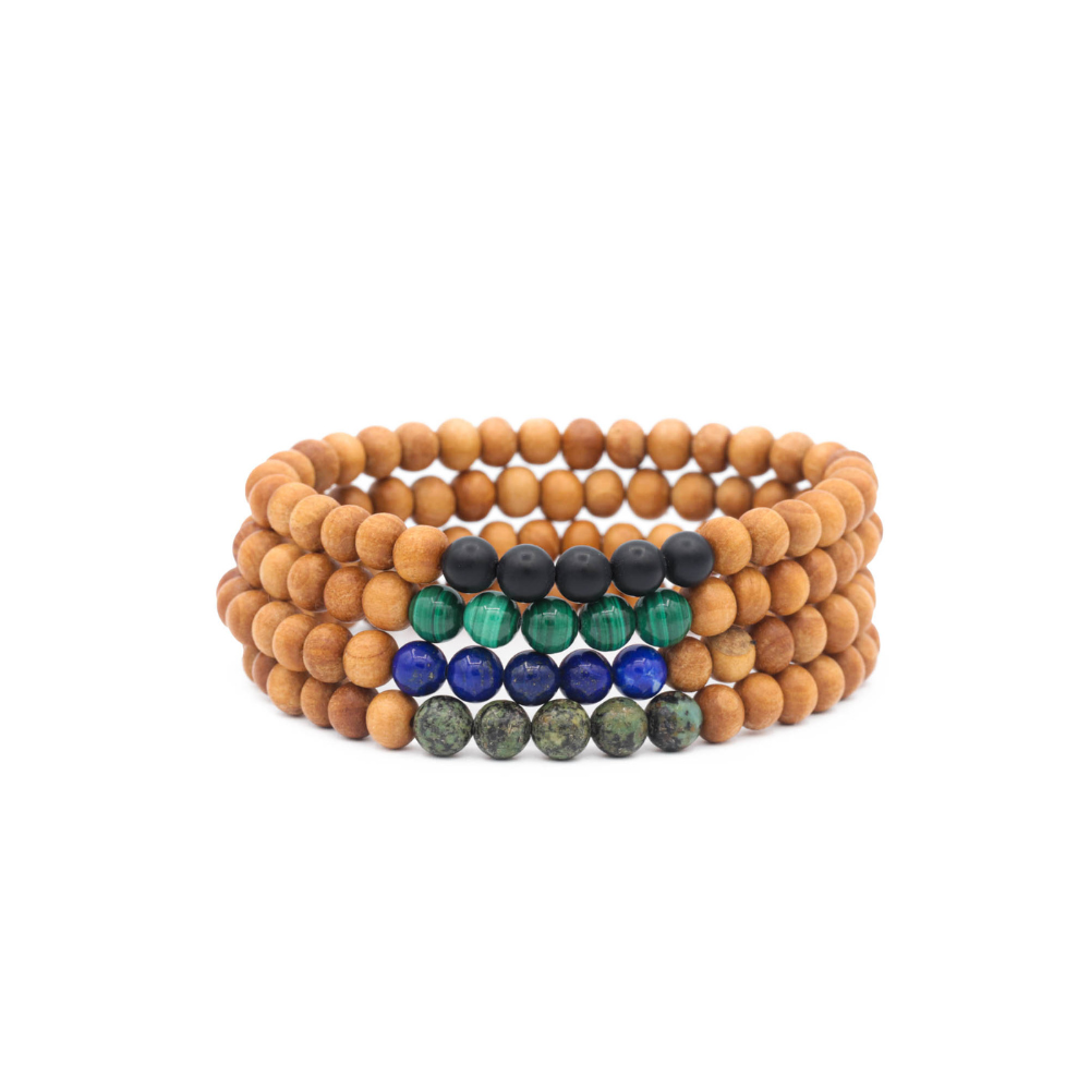 a stack of wooden bracelets with different colored beads