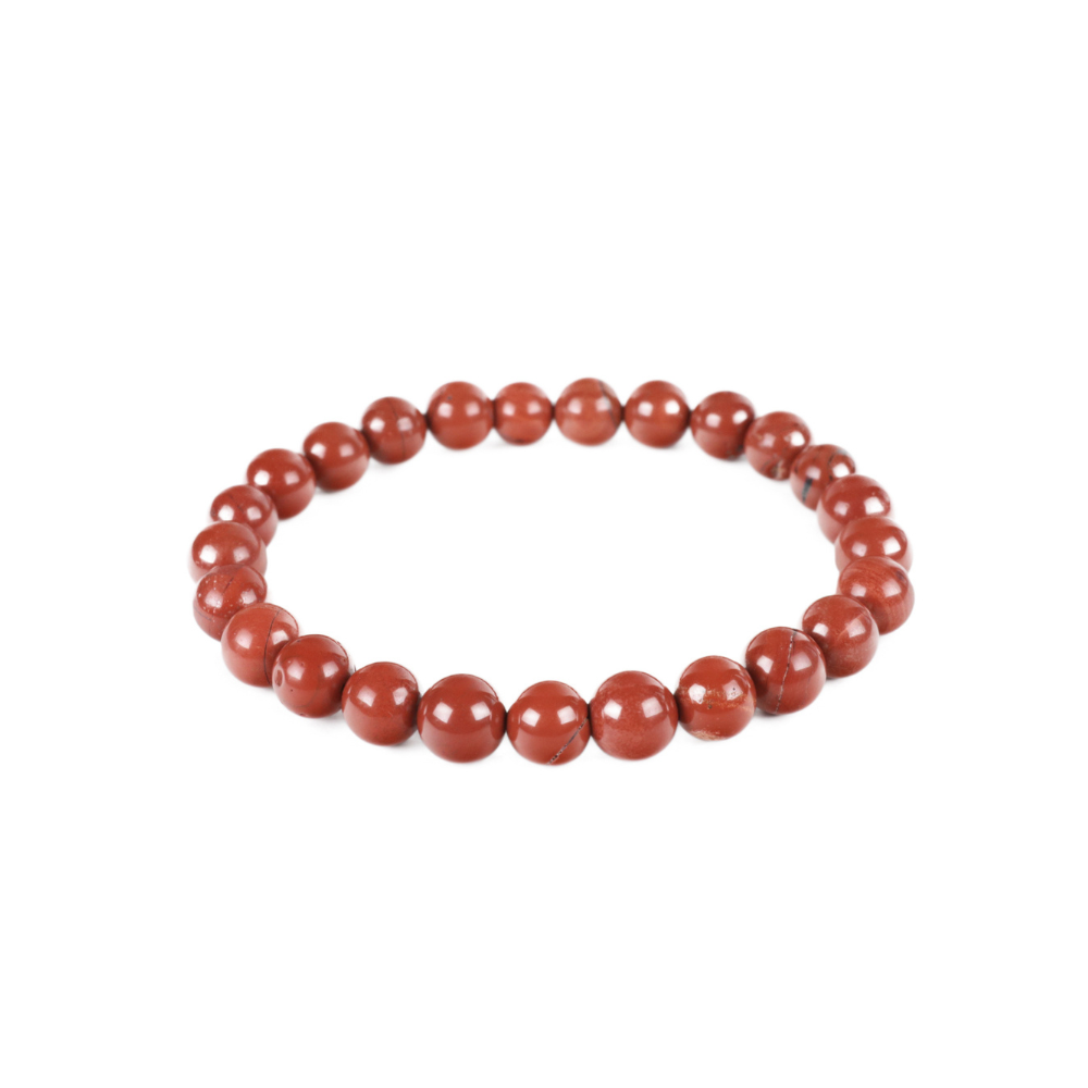 a red beaded bracelet on a white background