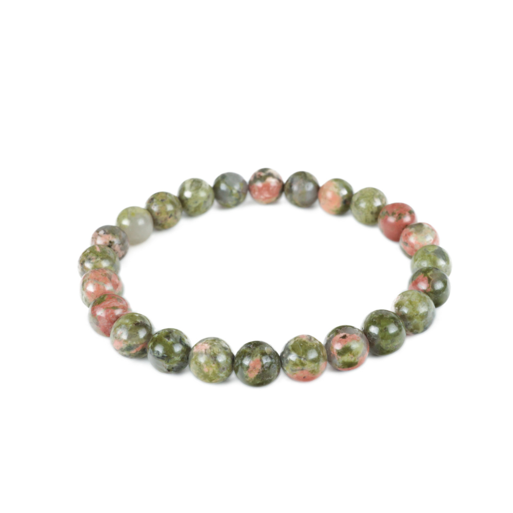 a bracelet made of green and pink beads