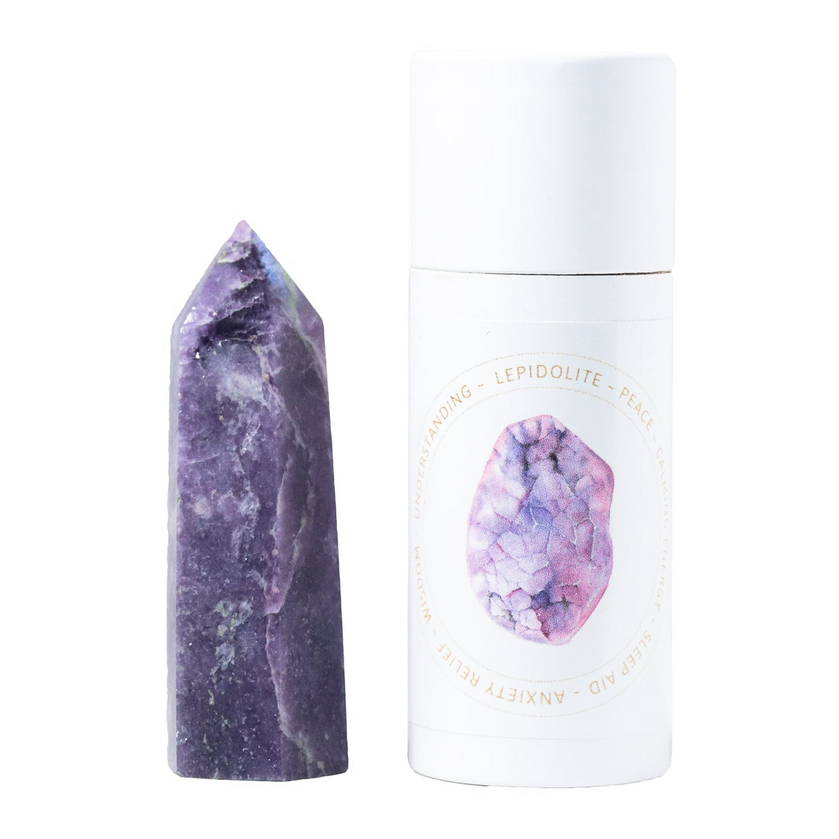a purple stone next to a white tube of deodorant
