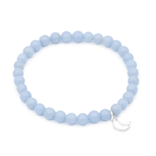 a bracelet with a crescent charm on a white background