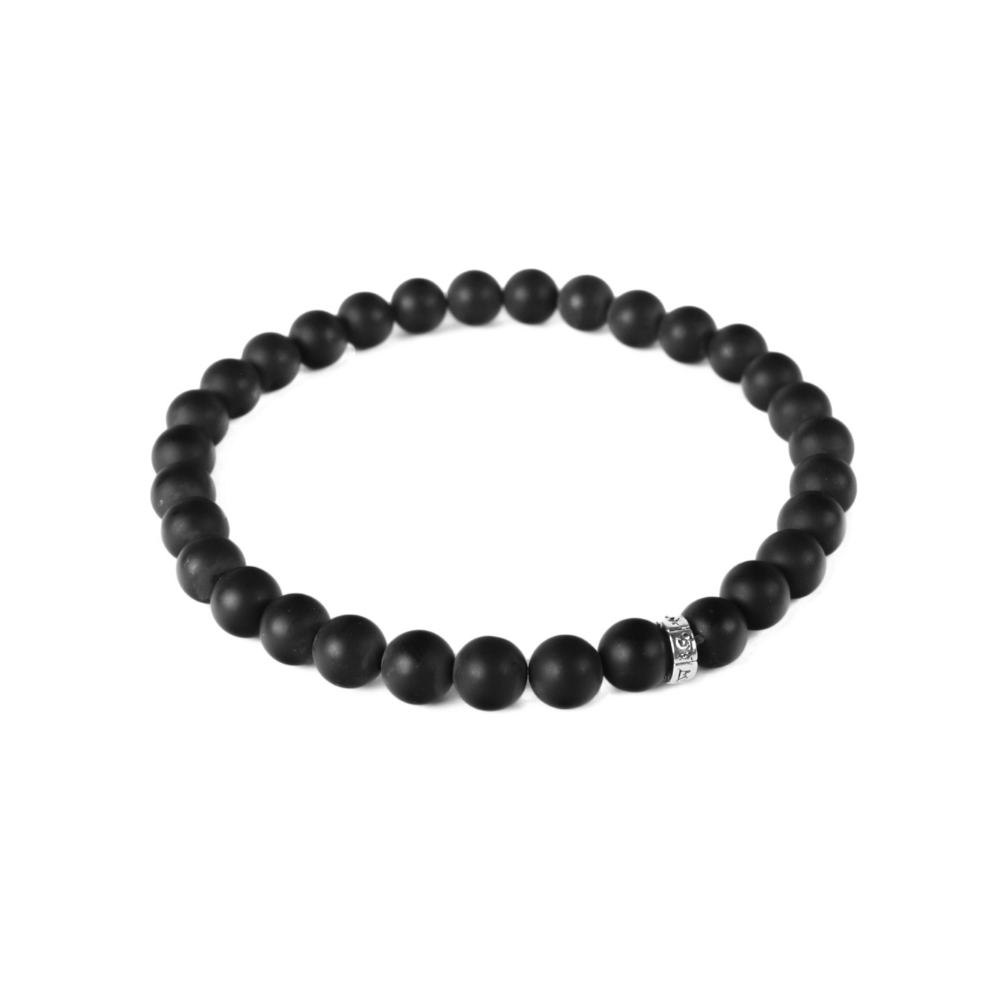 a black beaded bracelet on a white background