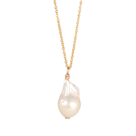 a necklace with a white pearl hanging from it