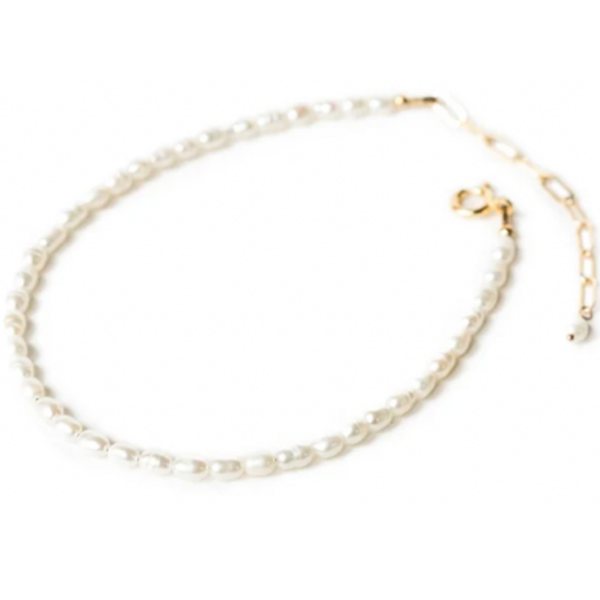 a white pearl necklace with a gold clasp