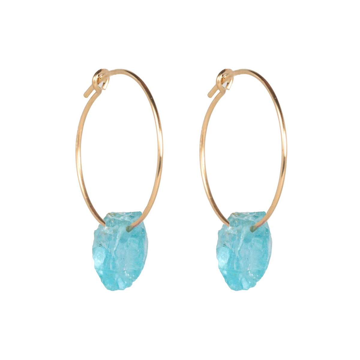 a pair of gold hoop earrings with a blue stone